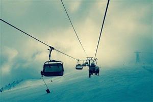 Ski lifts shrouded in the clouds